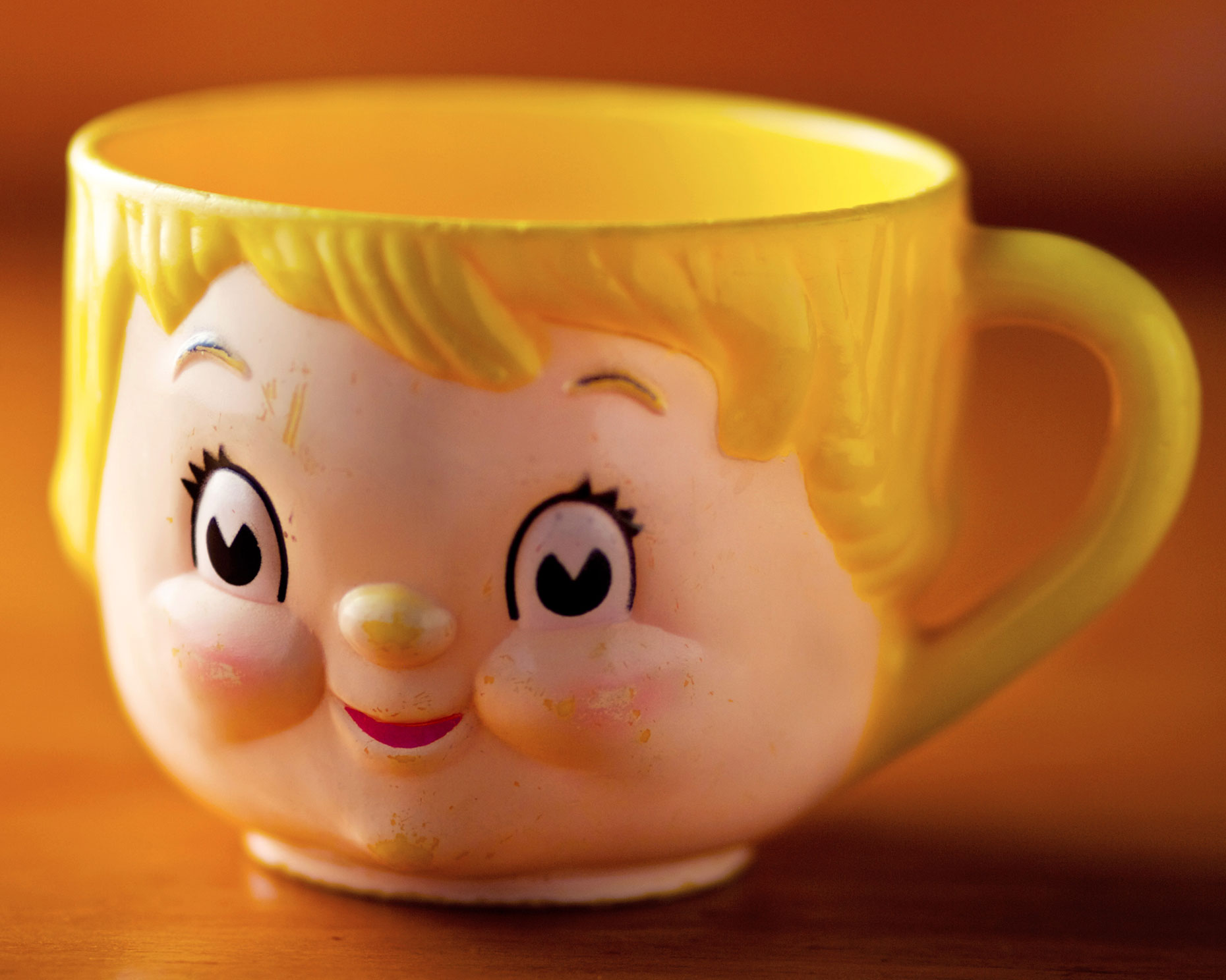 Still life of an old baby cup.