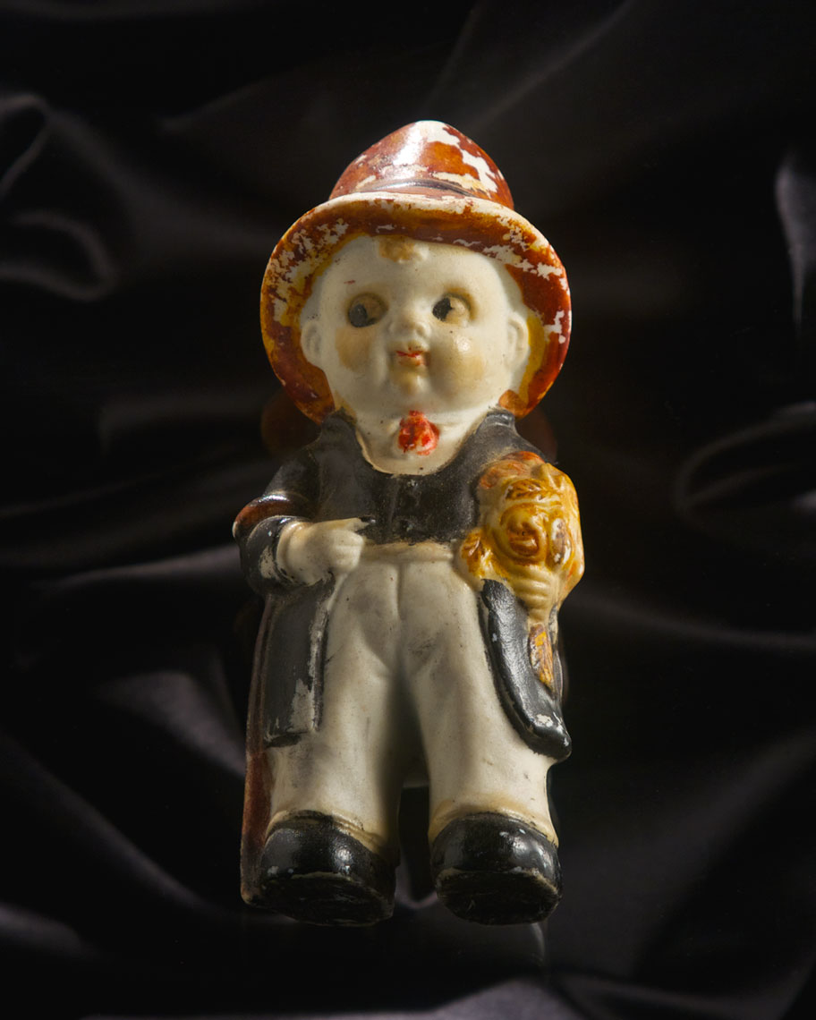  Still life of Antique Boy Figurine Doll.