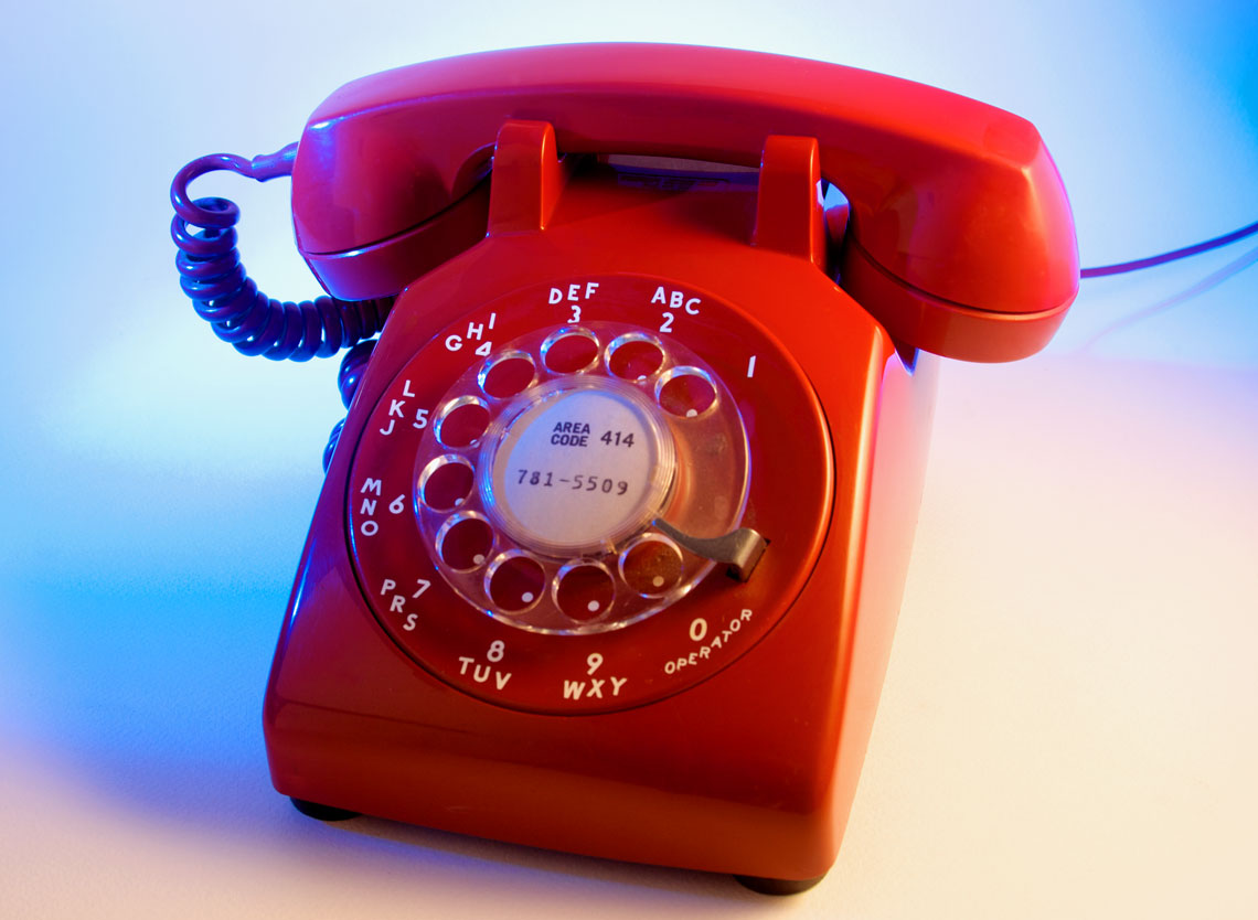 Still Life Photo of Red Rotary Dial Phone