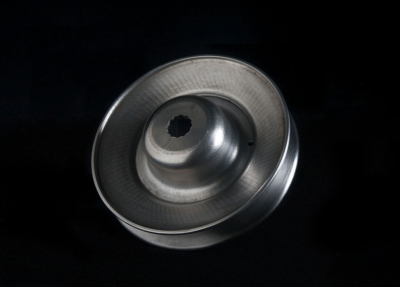 Still life of a machined pulley.